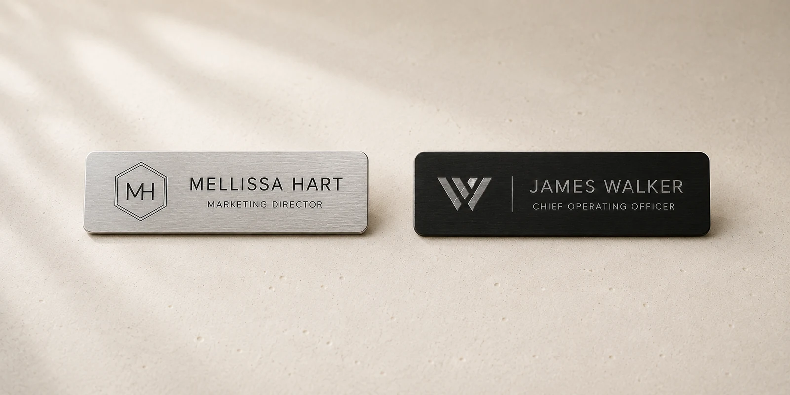 Silver and black engraved staff name badges